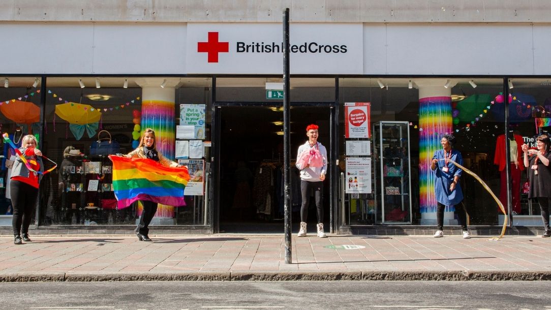 British Red Cross volunteers celebrate outside the British Red Cross charity shop in Hull.