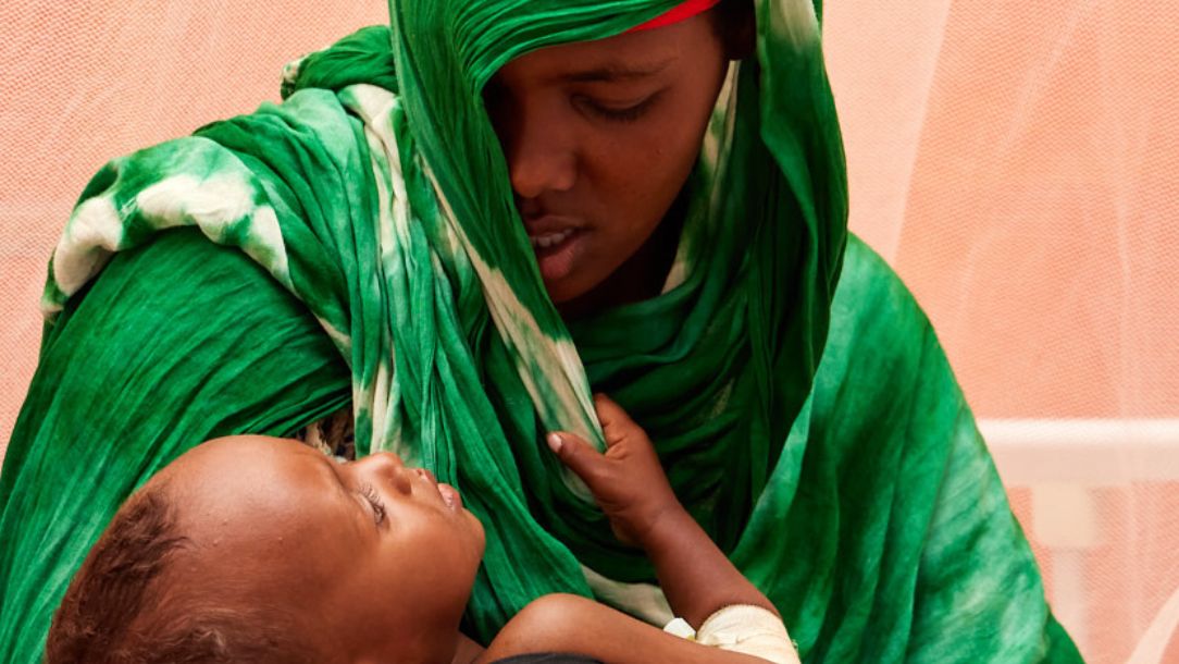 Leerto, 21, with her one-year-old son at the ICU wing of the stabilisation centre, where severely acute malnourished children are treated.