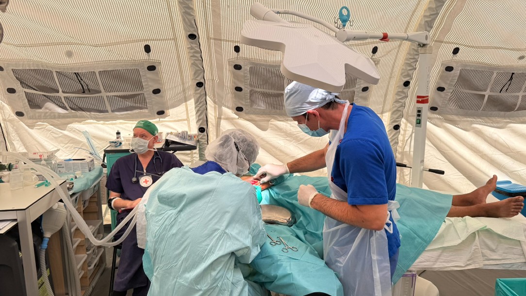 Operation theatre with surgeon Dr Ando, OT Nurse Haitam , and Anaesthetist Dr Hamish at the Rafah Red Cross Hospital repairing a nerve ending.