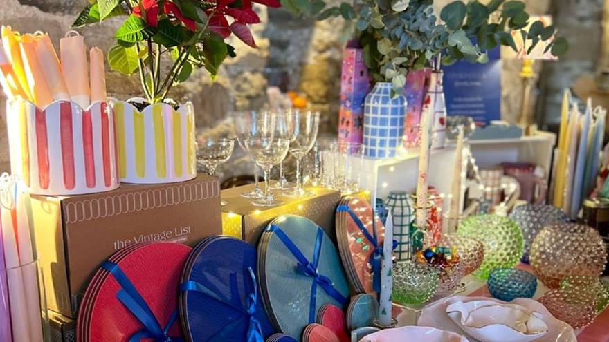 Plates, candles, festive items on a table