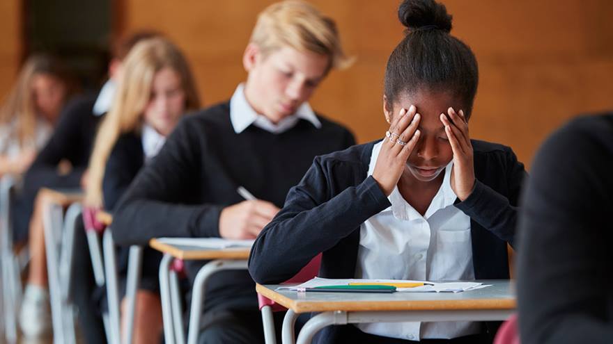 Student looks stressed while taking an exam