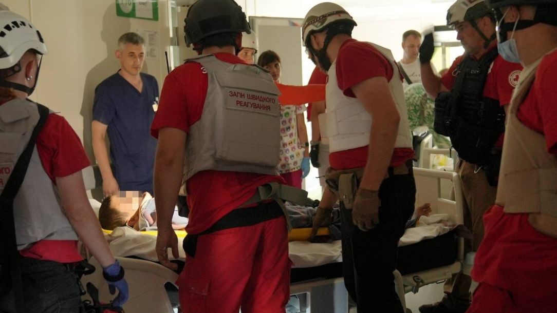 Emergency response teams evacuate children after explosions in Ukraine