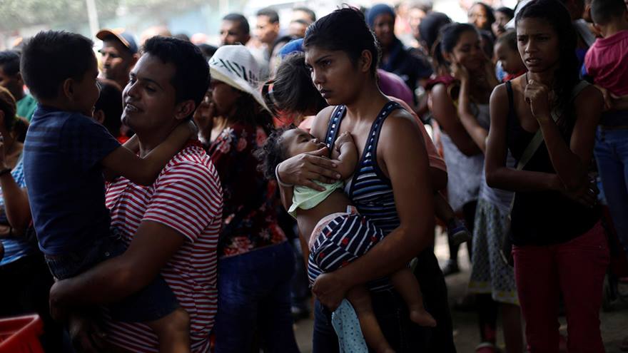 People waiting to receive humanitarian aid in Venezuala