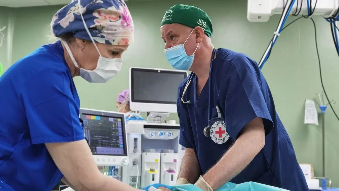 A medical team conducts war surgery at the European Gaza Hospital.