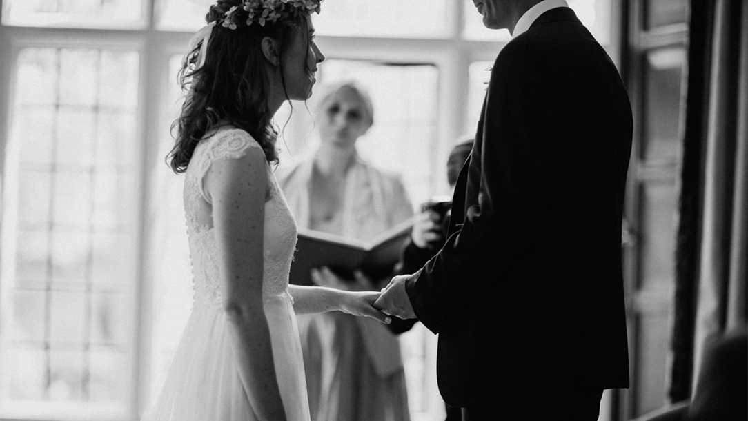 Laura and her husband making their wedding vows.