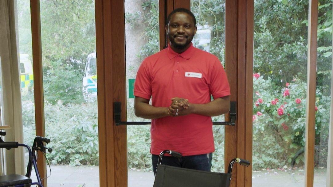 Still image from the people like us video shows a volunteer from the wheelchair service.