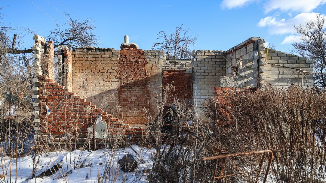 Broken buildings surrounded by snow in Cherchniv Ukraine