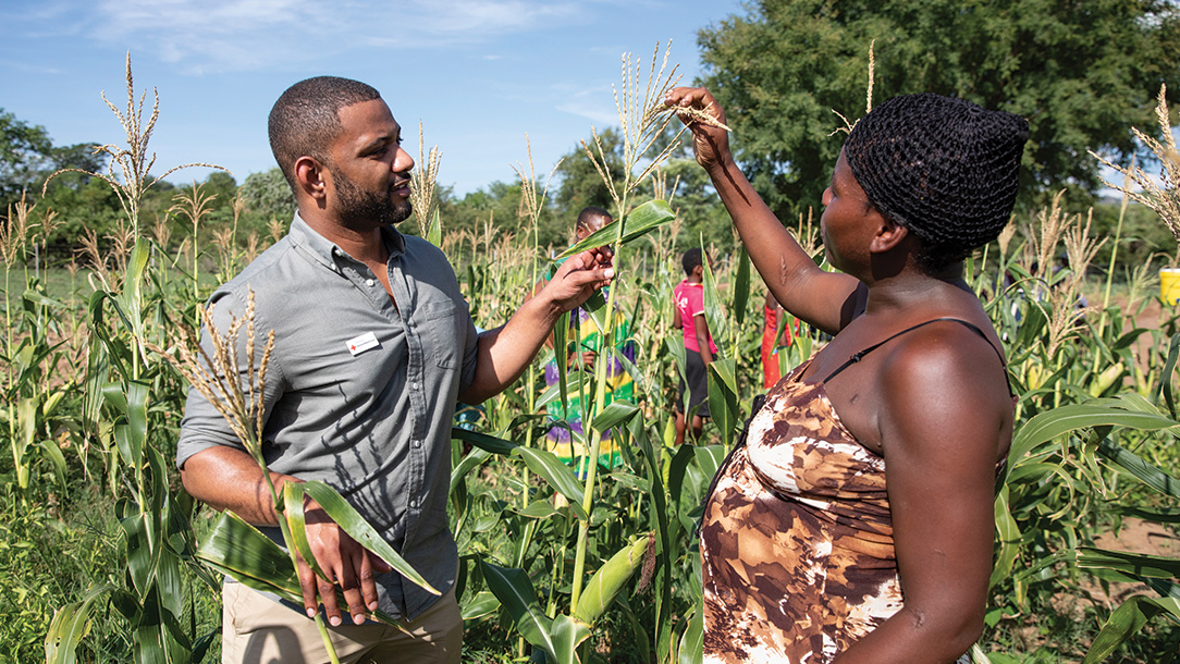 JB Gill talks to woman in Zimbabwe