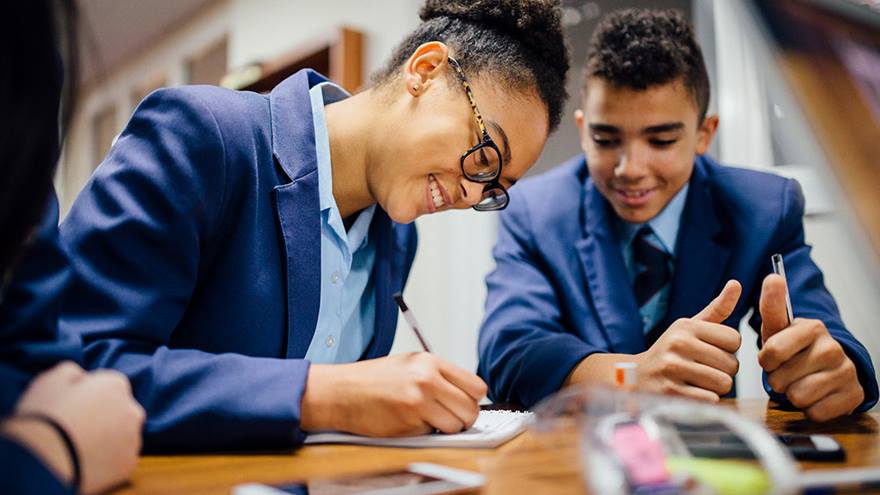 Young people working together at school