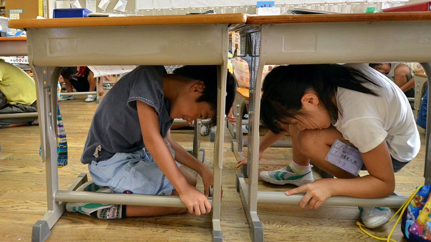 Schoolchildren during an earthquake drill.