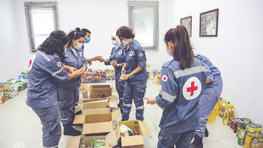 Lebanon Red Cross volunteers sort through essential supplies