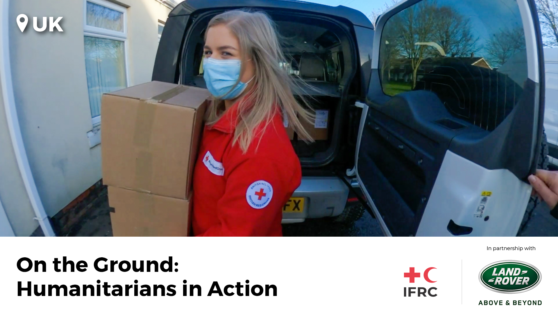 In a thumbnail for the On the Ground: Humanitarians in Action film, a British Red Cross volunteer is seen taking a box of PPE out of the boot of a Land Rover vehicle