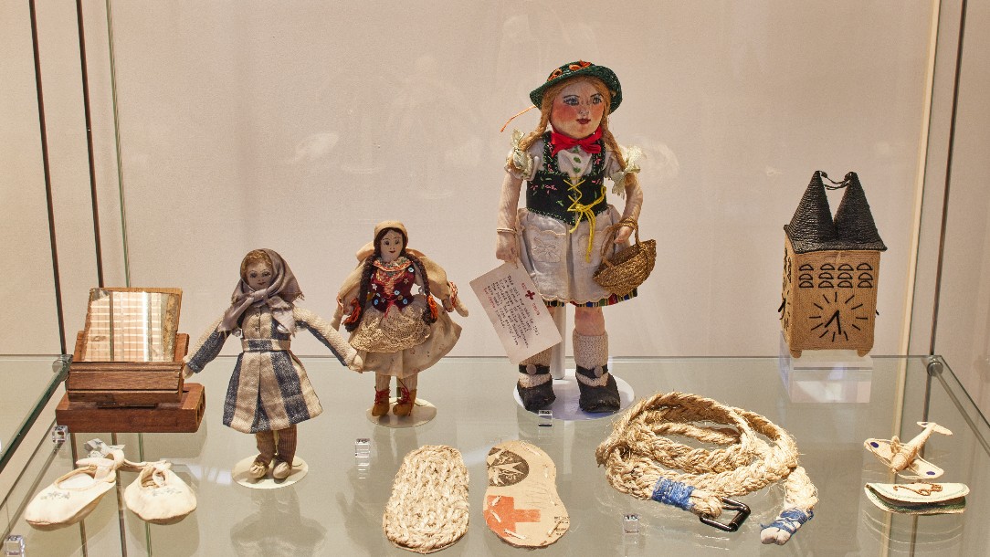 Objects made by civilian internees and concentration camp survivors during the Second World War. Some were made using packaging materials from Red Cross food parcels. 