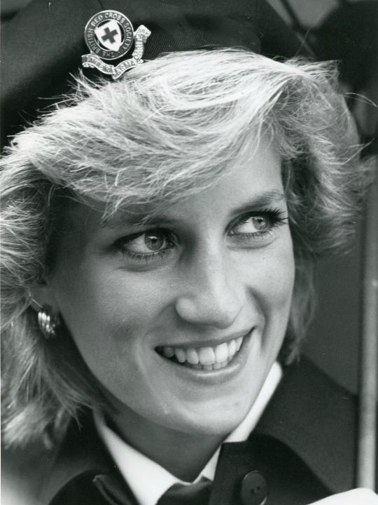 Close-up portrait of Princess Diana's face, smiling.