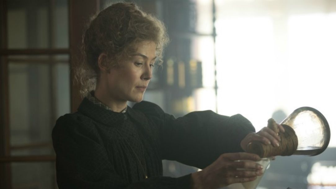 A still from the film Radioactive, showing Marie Curie, played by Rosamund Pike, in her lab.